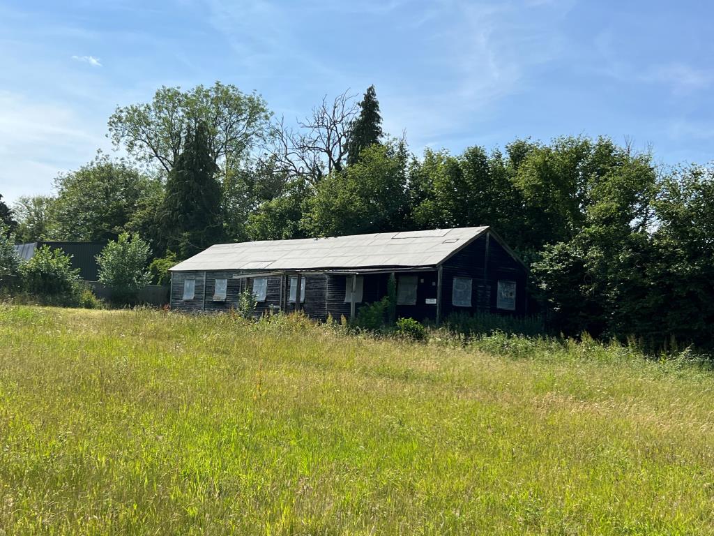 Lot: 26 - BARN FOR CONVERSION IN RURAL SETTING ON PLOT OF JUST OVER THREE-QUARTERS OF AN ACRE - Wide shot of barn with planning for conversion